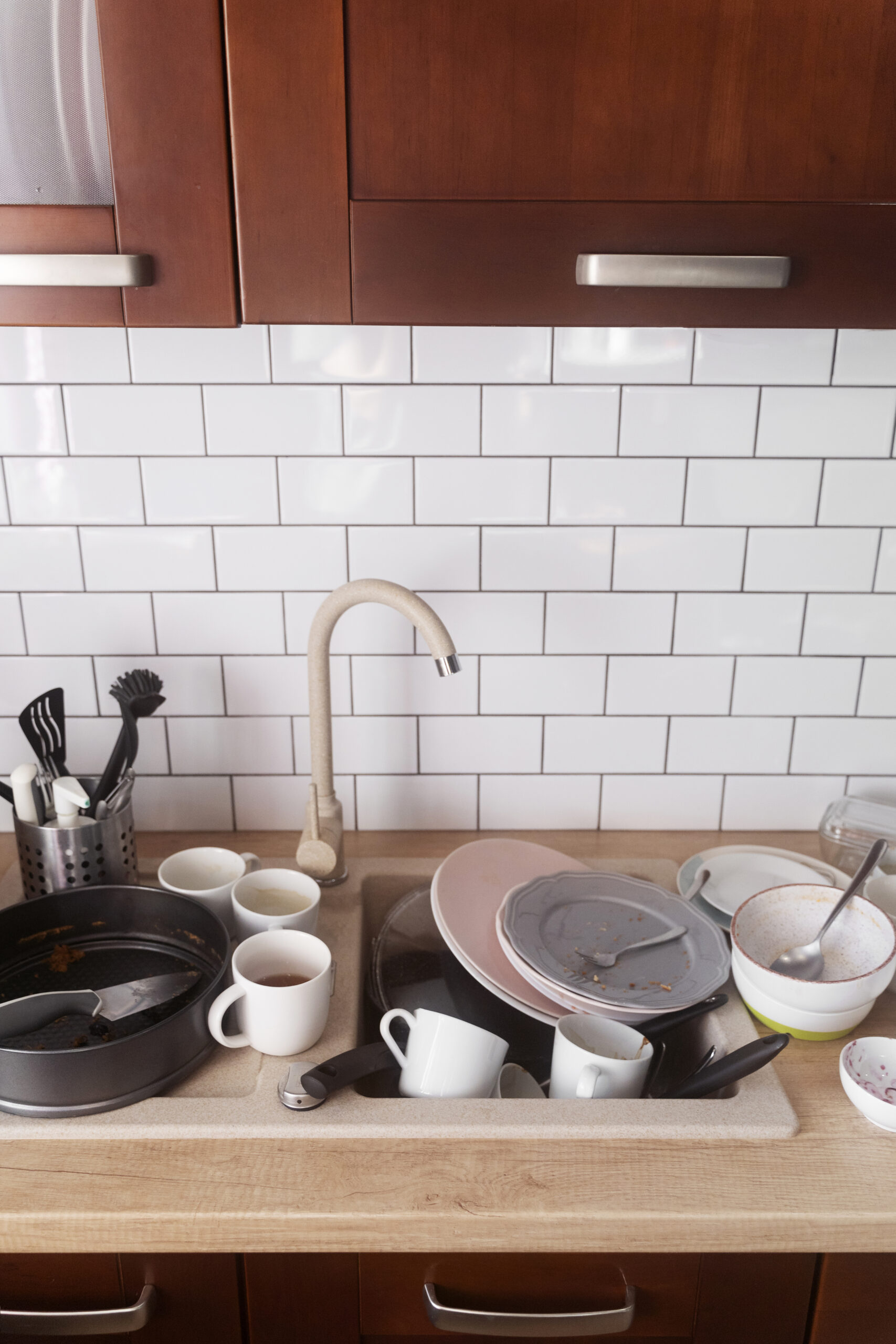 dirty home concept with dishes stack scaled.jpg